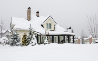 Exterior of a home covered in snow